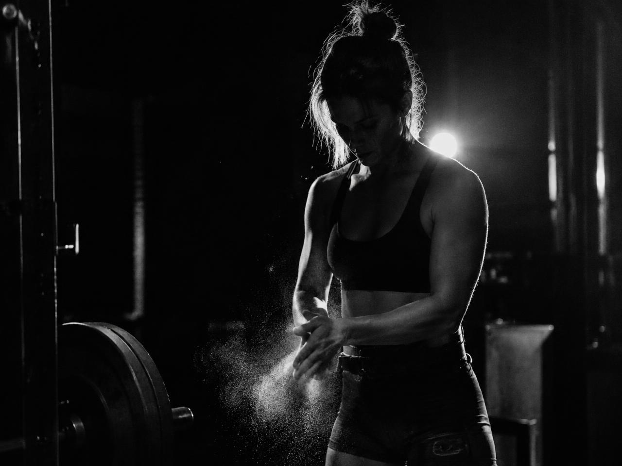 Athlete training in a fitted top